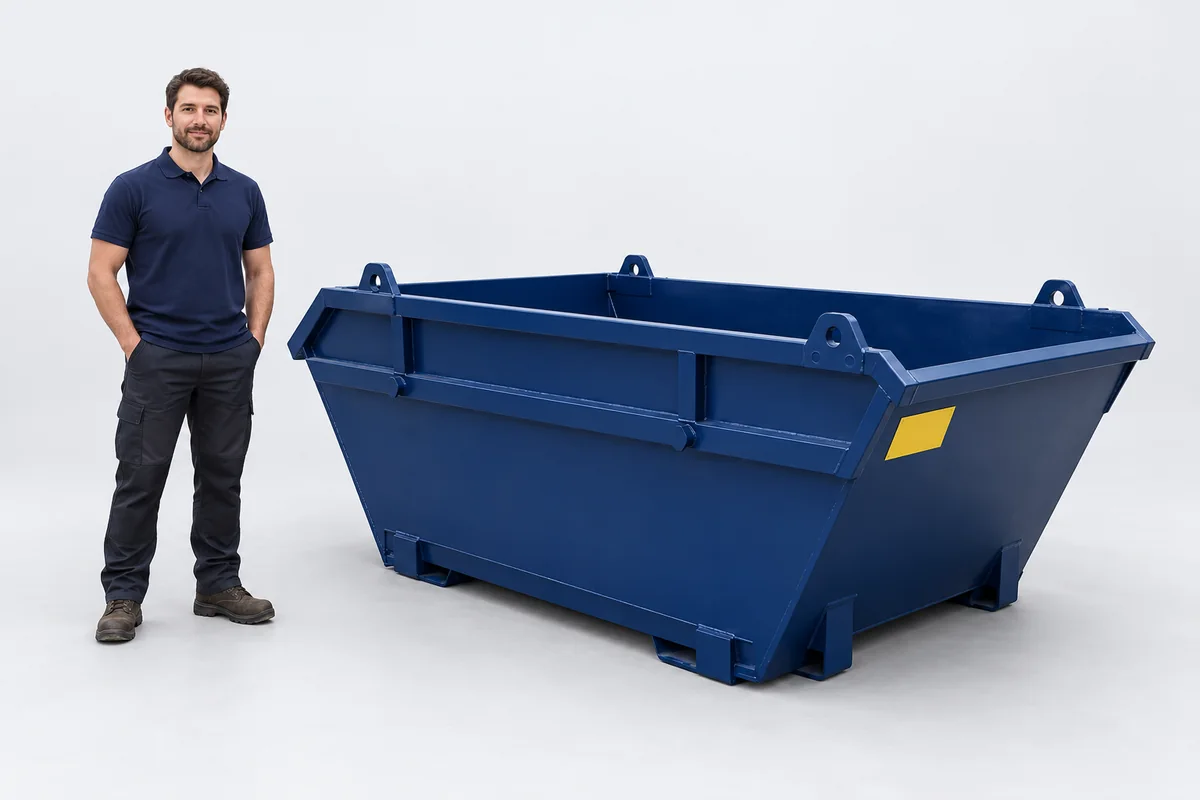 Man standing beside a 6-yard blue skip